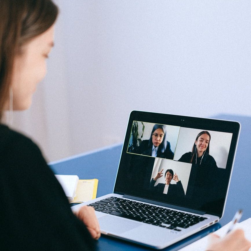 Woman in Zoom meeting on laptop