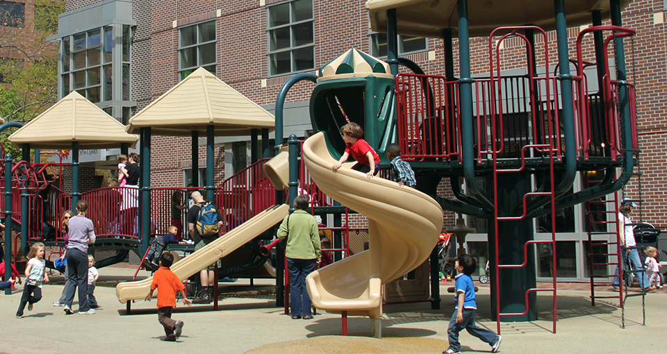 Children playing on an Iowa City playground.